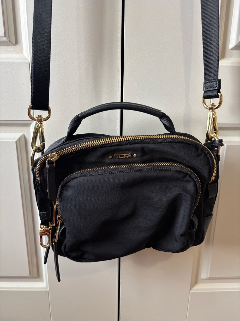 Tumi Black Nylon Crossbody Bag with Gold Hardware Accents